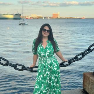 Women in a dress by the sea
