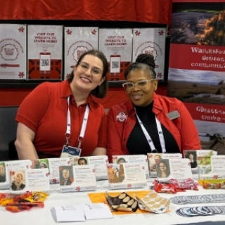 Two women at a conference table
